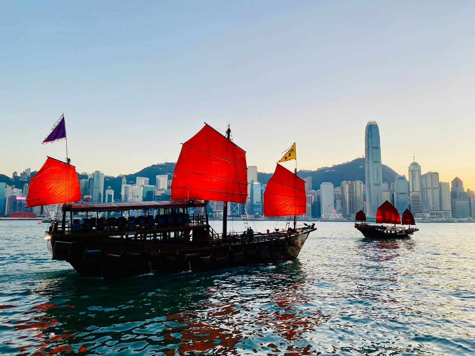 Junk boats with red sails on Victoria Harbour, Hong Kong
