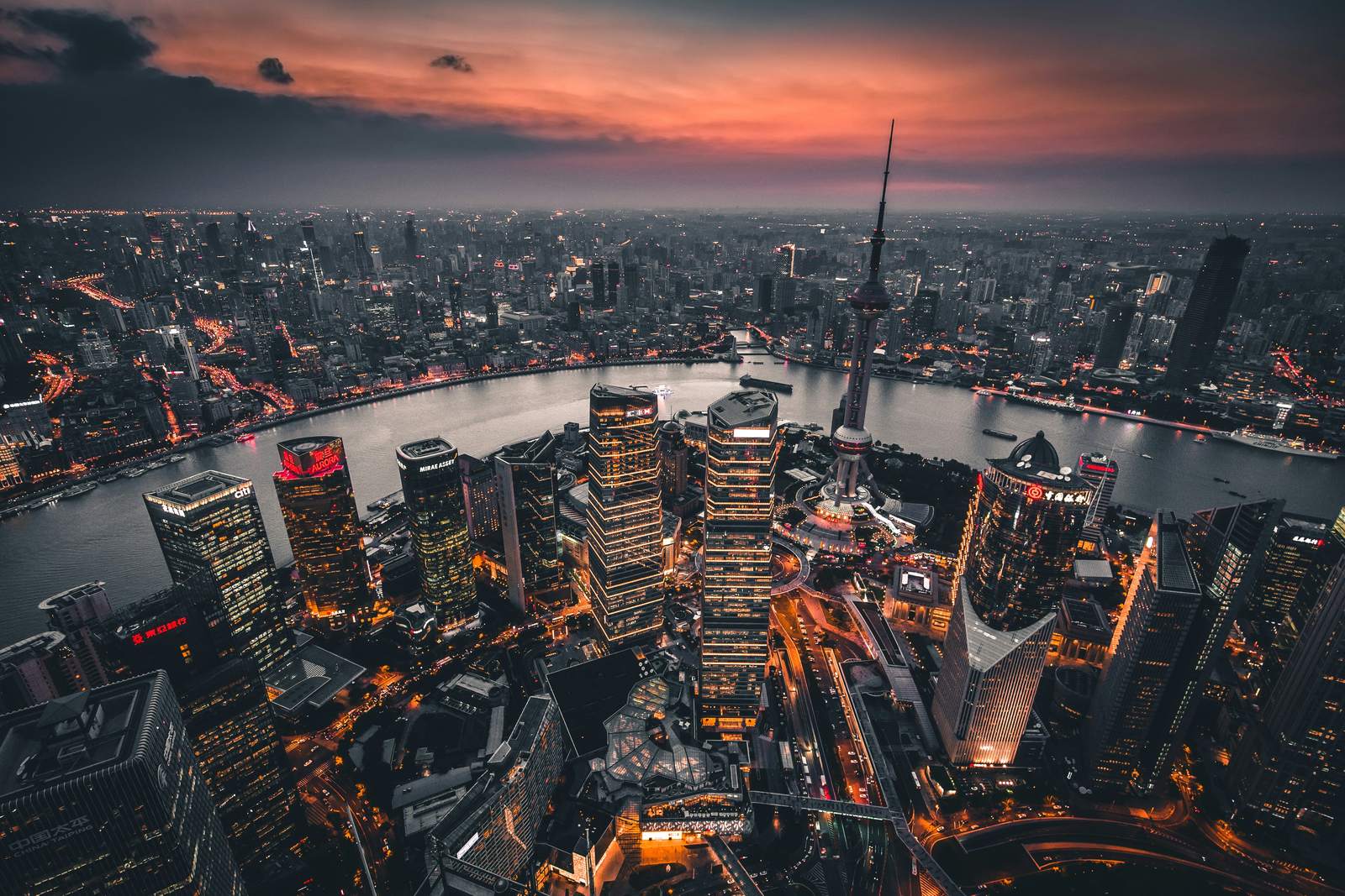 Aerial view of Lujiazui and the Huangpu River in Shanghai at dusk