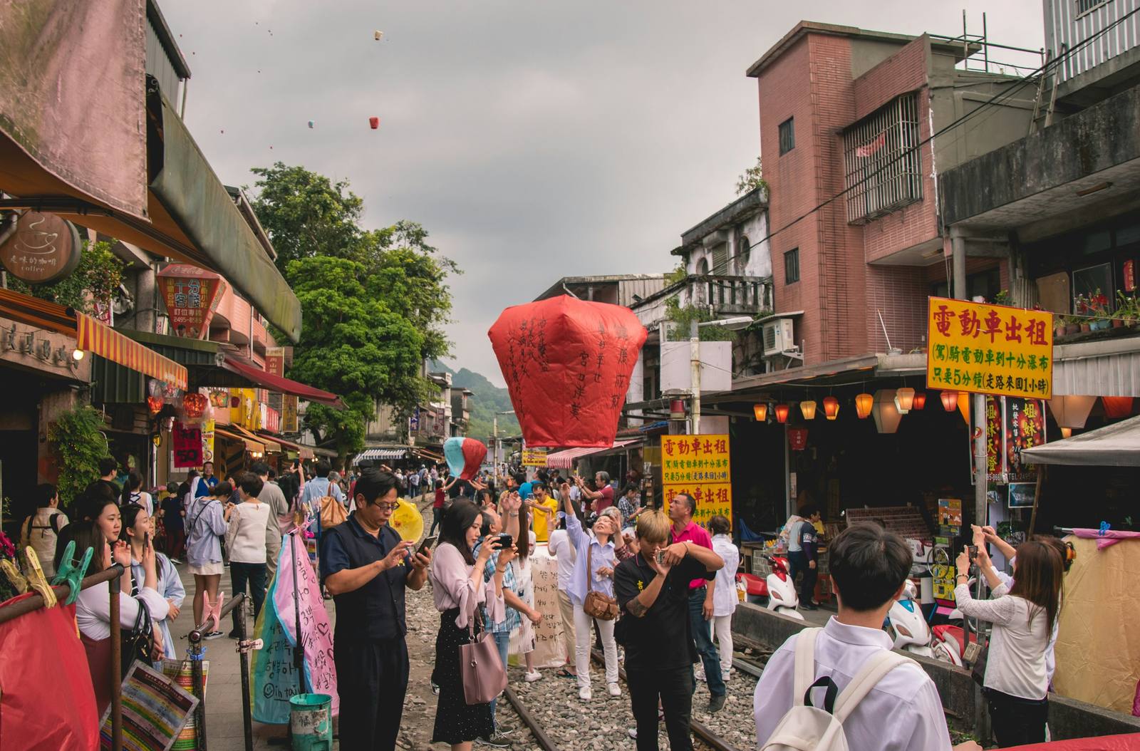 Sky lanterns being released over the railway in Shifen, Taiwan