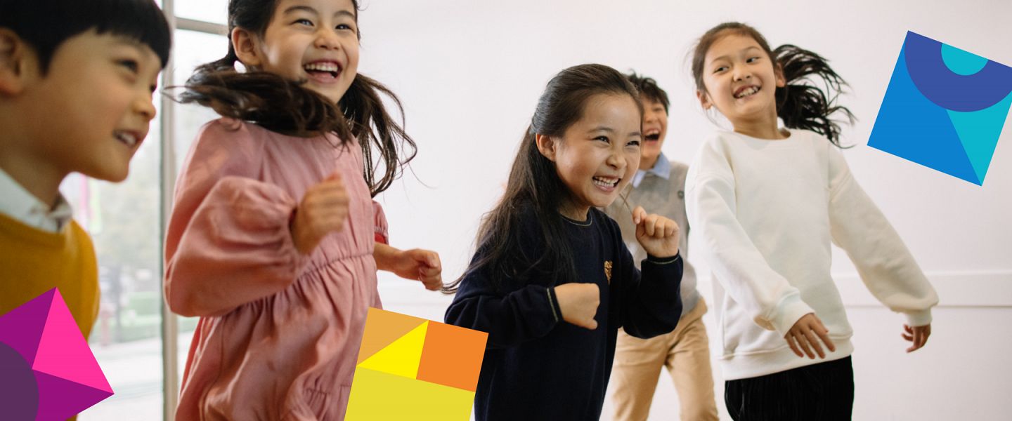 Happy young learners dancing in an English class in China