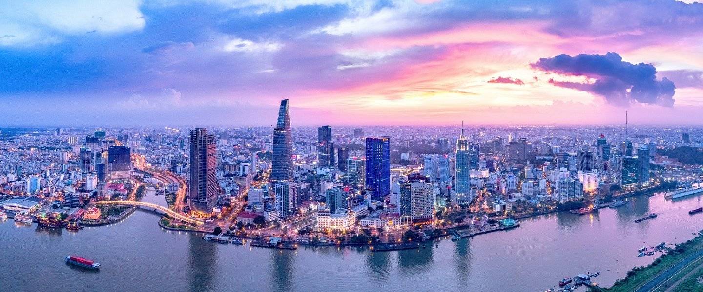 Ho Chi Minh City skyline and the Saigon River at sunset, teaching jobs in Vietnam