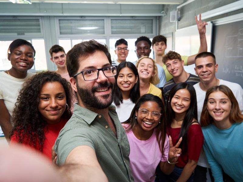 Teacher taking a selfie with his smiling class